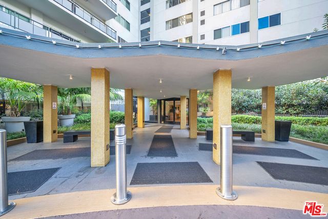 a view of a building with living room and balcony
