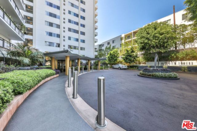 a view of a street with a building in the background