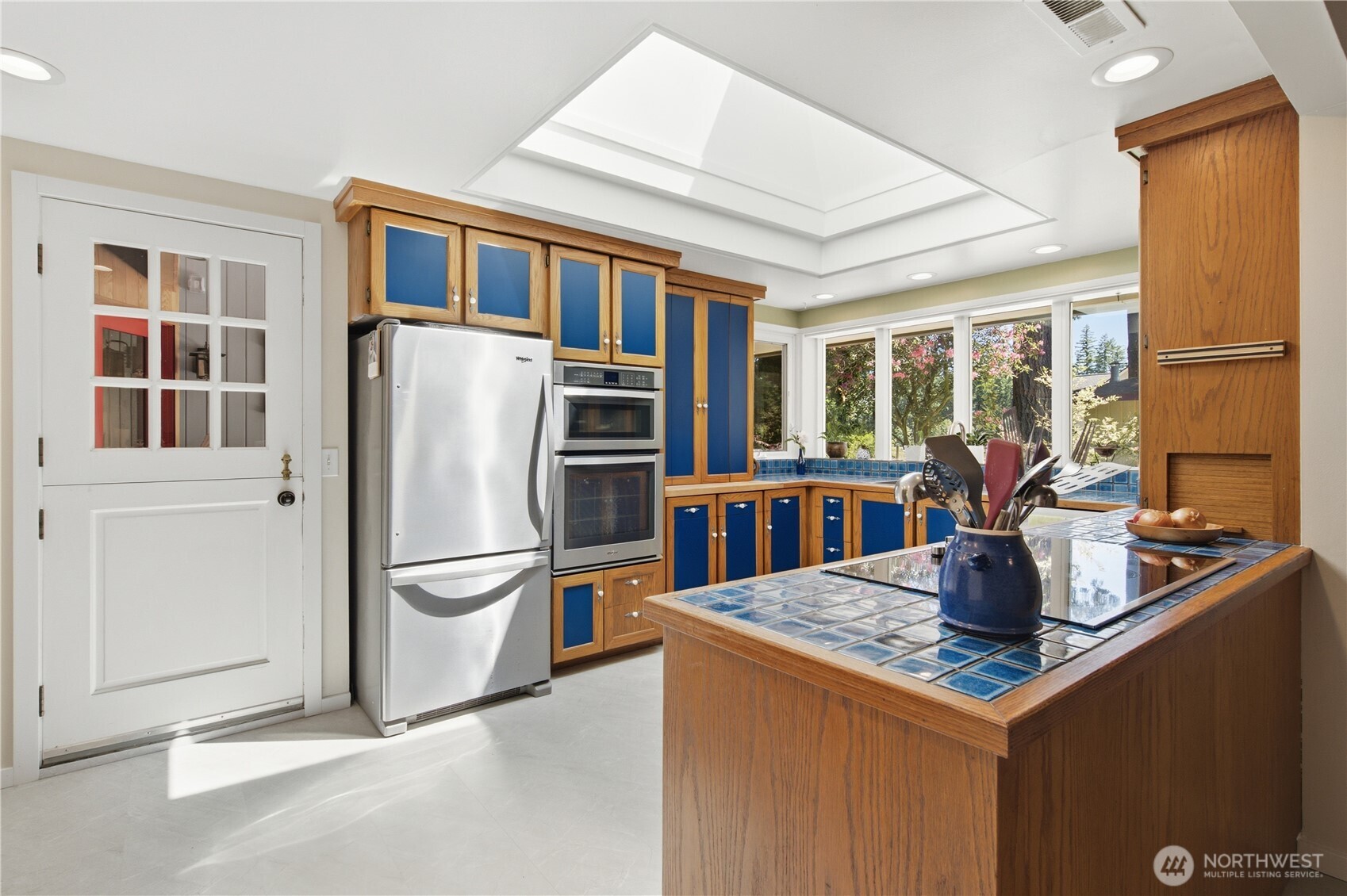 3050 Southeast Mullenix Road Port Orchard, WA 98367 - Photo 11 of 40 a kitchen with stainless steel appliances granite countertop a refrigerator and a stove
