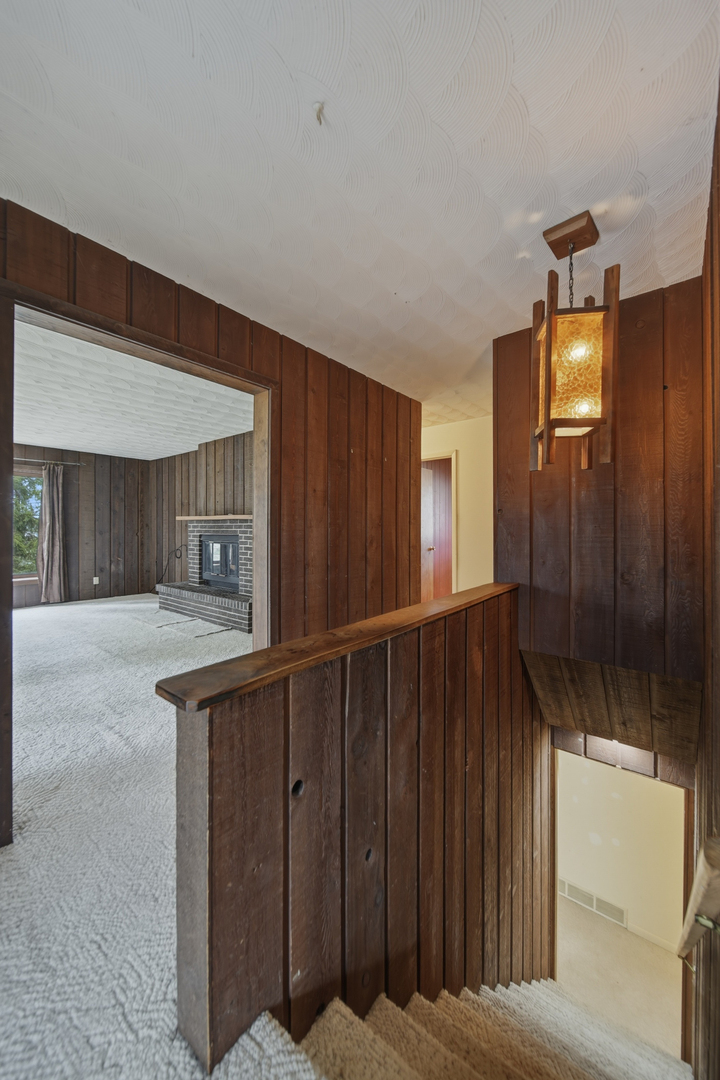604 Hillandale Court Morrison, IL 61270 - Photo 22 of 35 a view of a hallway with wooden floor and staircase