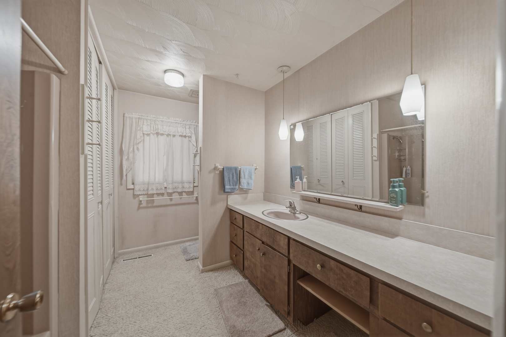 604 Hillandale Court Morrison, IL 61270 - Photo 27 of 35 a spacious bathroom with a double vanity sink a mirror and a shower