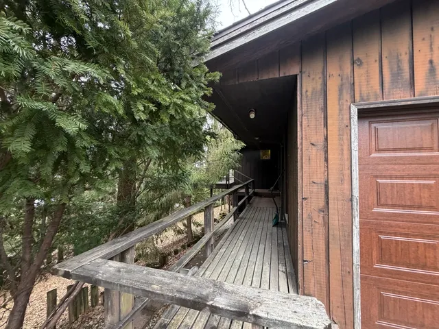 a balcony with wooden floor
