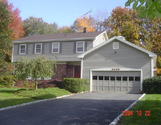 5 Ranch Drive Trumbull, CT 06611 - Photo 1 of 1 a front view of a house with a garden