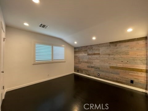 5352 Edinger Avenue Huntington Beach, CA 92649 - Photo 12 of 17 a view of an empty room with wooden floor
