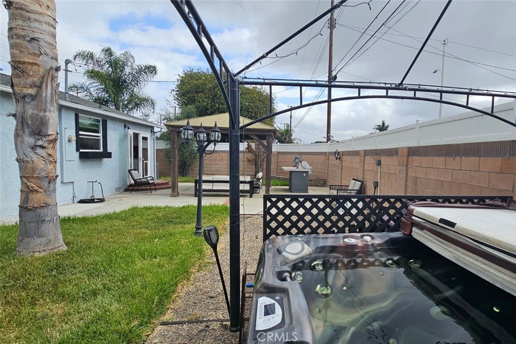 5352 Edinger Avenue Huntington Beach, CA 92649 - Photo 13 of 17 a patio with table and chairs