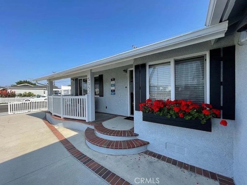 5352 Edinger Avenue Huntington Beach, CA 92649 - Photo 17 of 17 a front view of a house having yard