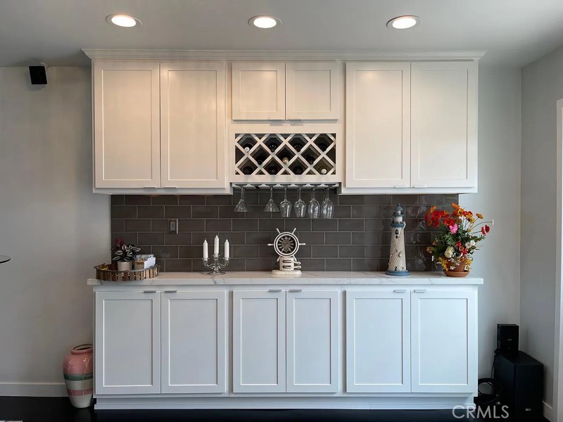 5352 Edinger Avenue Huntington Beach, CA 92649 - Photo 5 of 17 a kitchen with white cabinets and sink