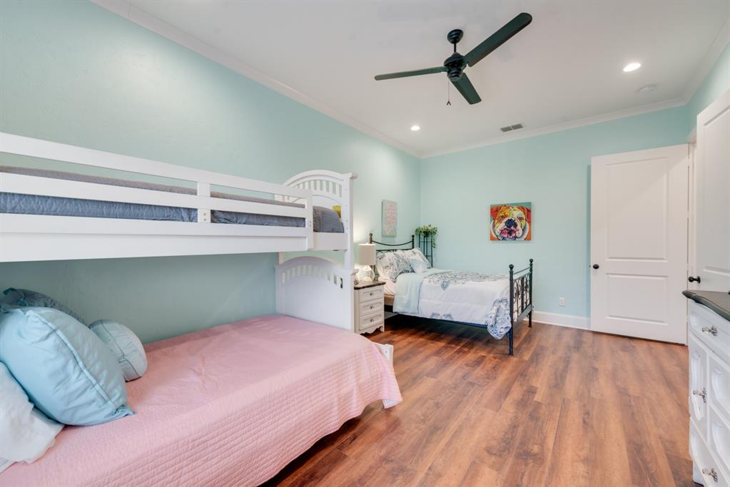 10794 County Road 334 Tyler, TX 75708 - Photo 18 of 40 a bedroom with a bed and wooden floor