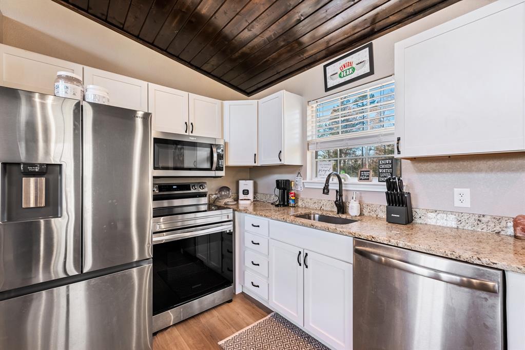 10794 County Road 334 Tyler, TX 75708 - Photo 28 of 40 a kitchen with stainless steel appliances a refrigerator sink and microwave