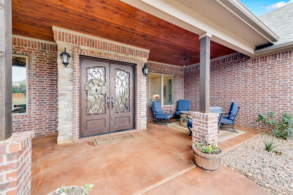 10794 County Road 334 Tyler, TX 75708 - Photo 4 of 40 a view of a patio with couple of chairs and a potted plant