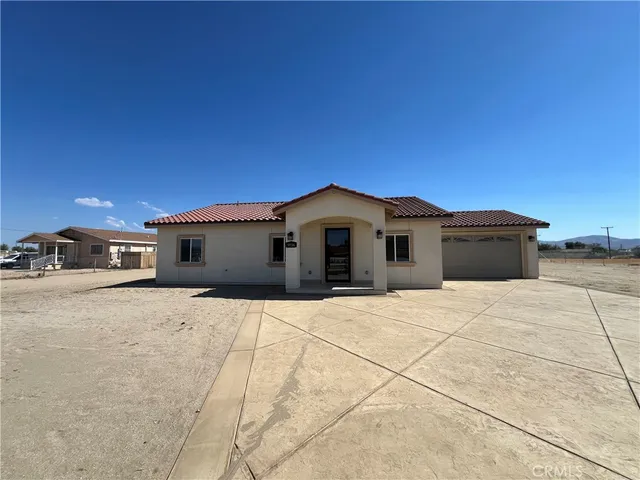a house with trees in the background