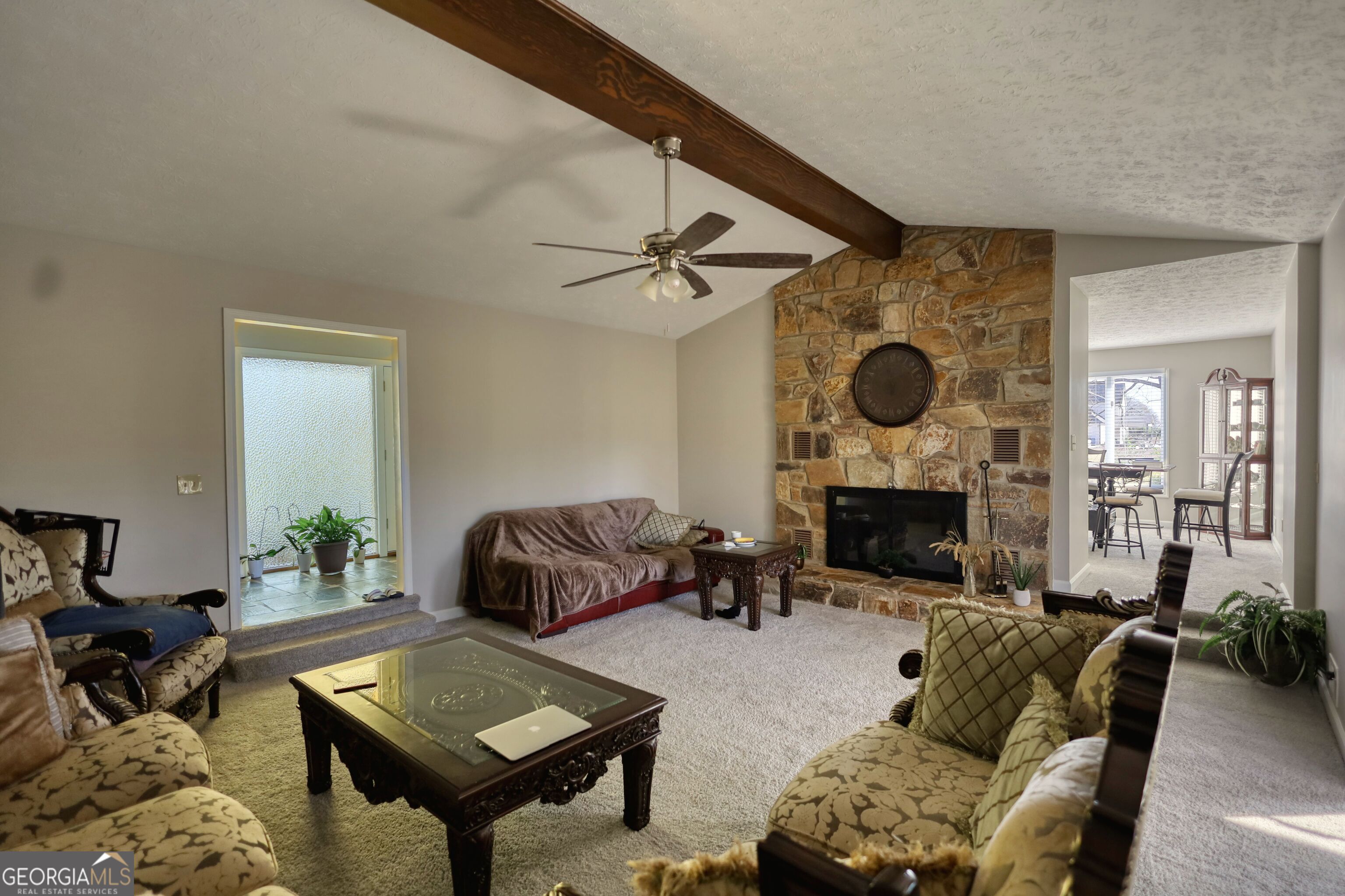 610 Loth Wages Road Dacula, GA 30019 - Photo 11 of 70 a living room with furniture and a fireplace