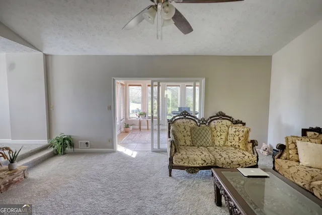 a view of a dining room with furniture wooden floor and chandelier