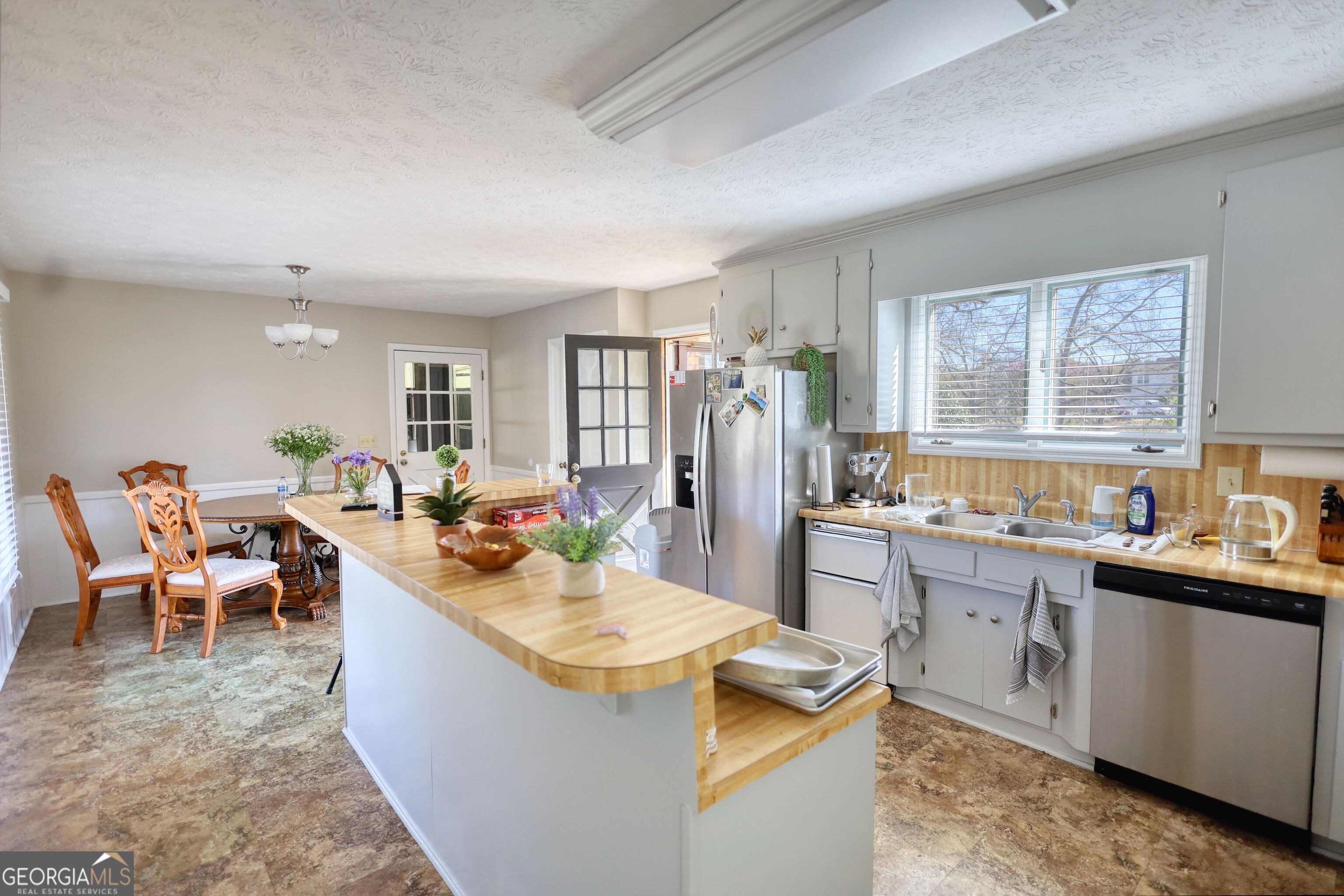610 Loth Wages Road Dacula, GA 30019 - Photo 18 of 70 a view of a kitchen and dining room