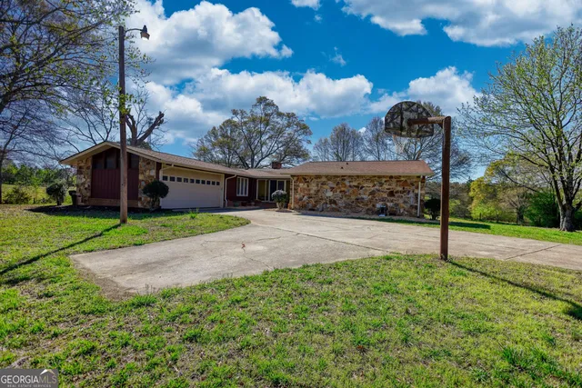 a view of a park with large trees