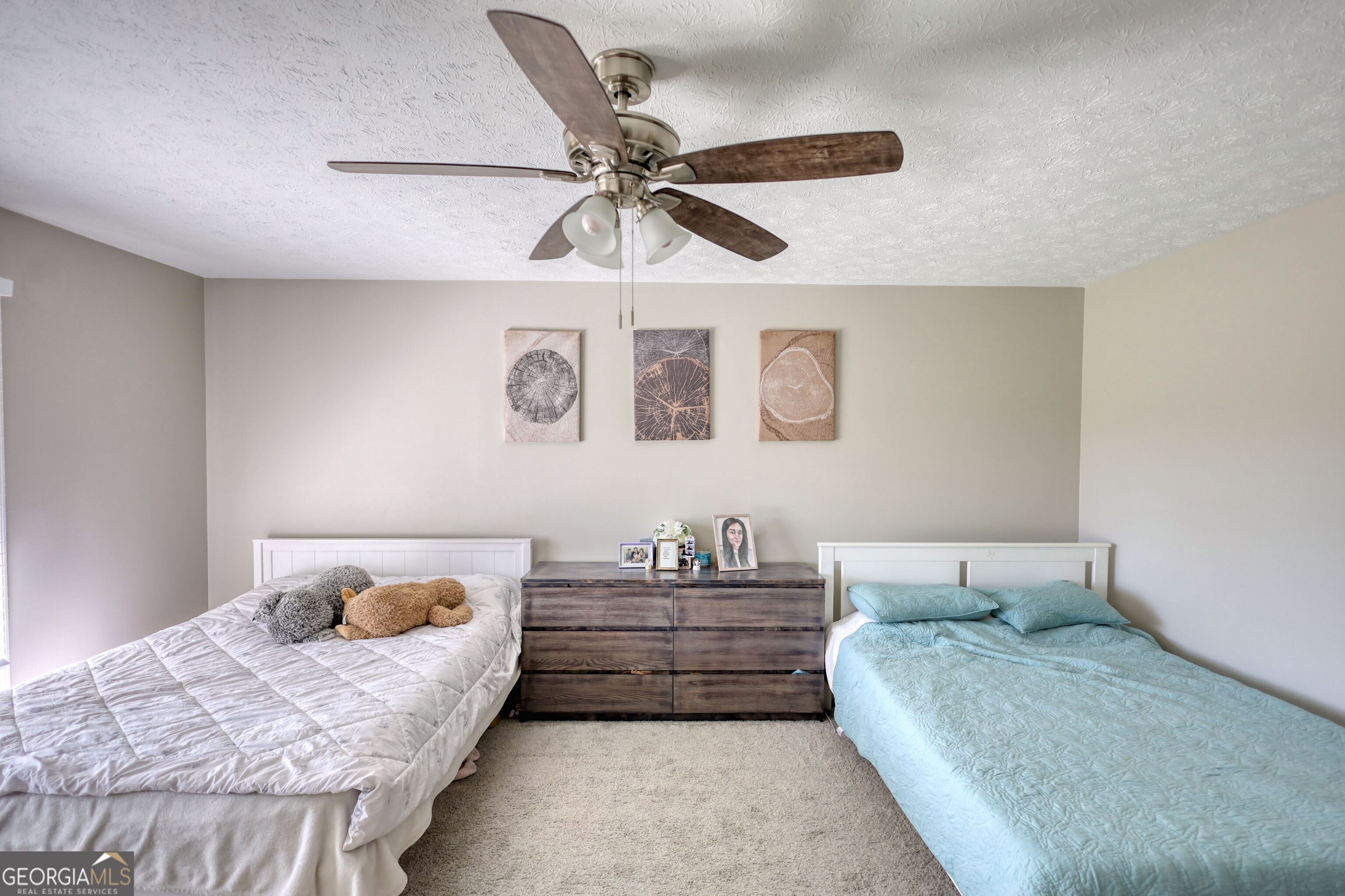610 Loth Wages Road Dacula, GA 30019 - Photo 24 of 70 a bedroom with a bed and ceiling fan