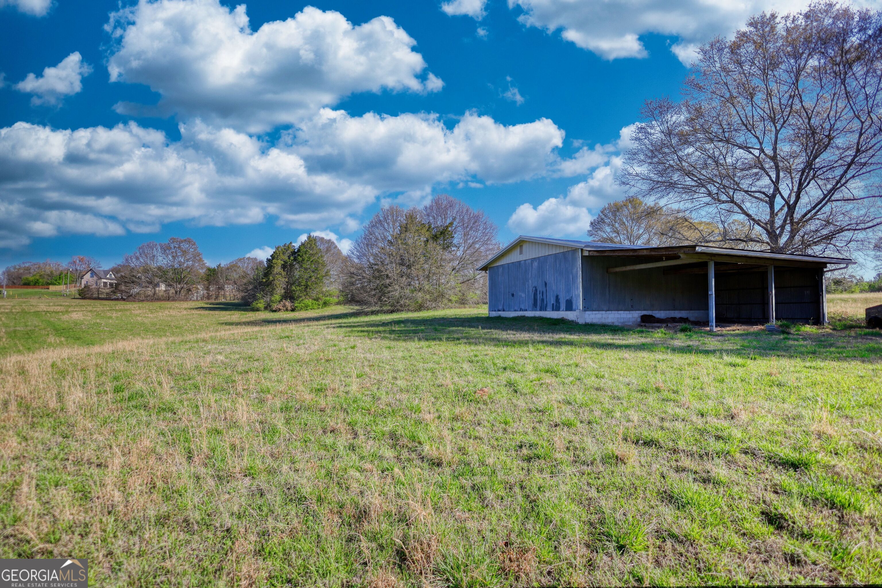 610 Loth Wages Road Dacula, GA 30019 - Photo 28 of 70 a view of a house with garden and yard