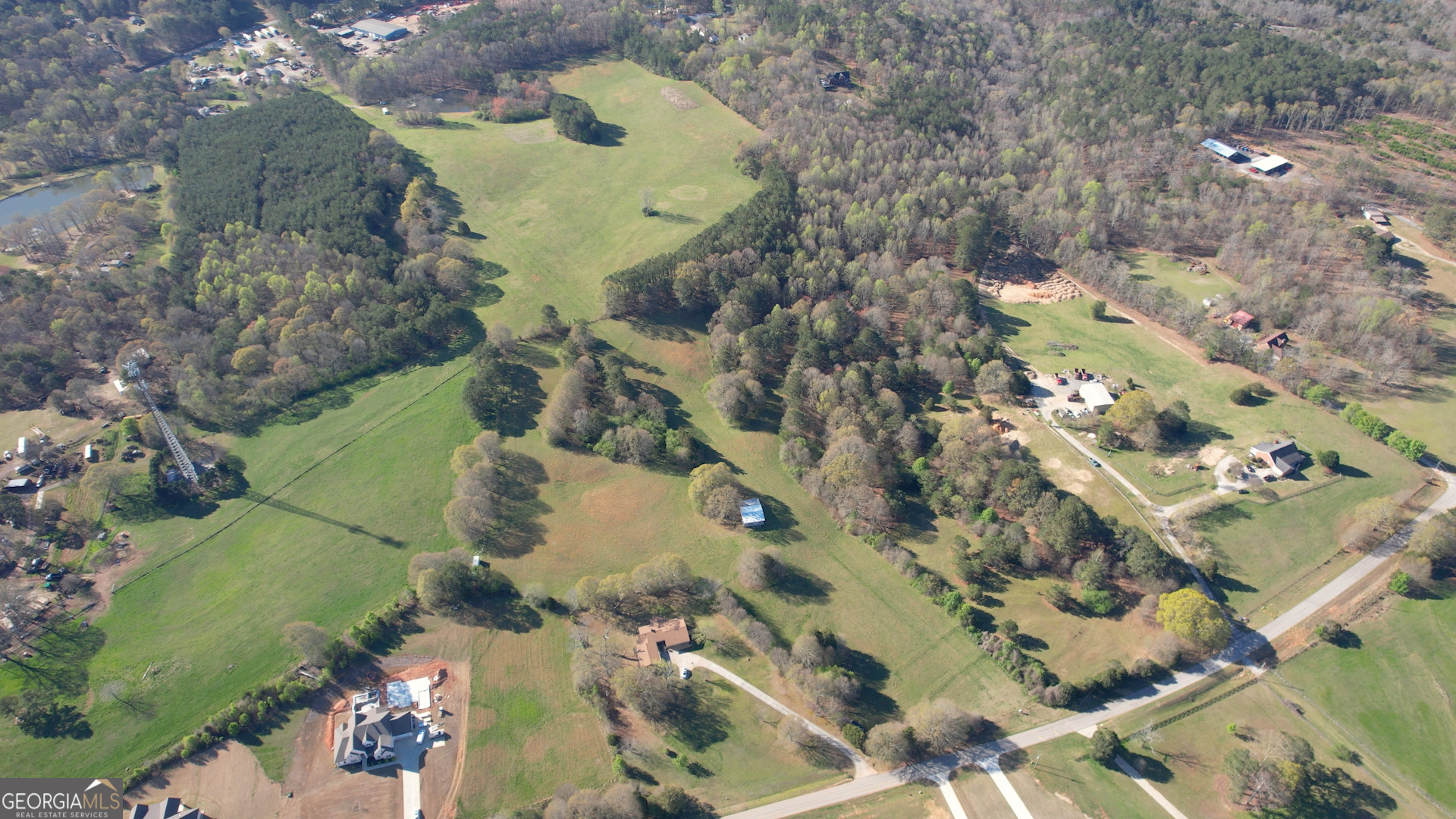 610 Loth Wages Road Dacula, GA 30019 - Photo 63 of 70 an aerial view of a house with a swimming pool