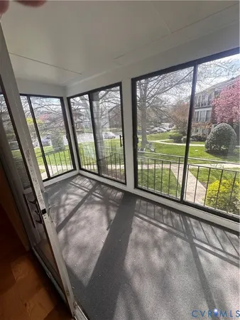 a view of an empty room with a large window