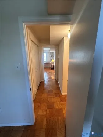 a view of a hallway with a furniture