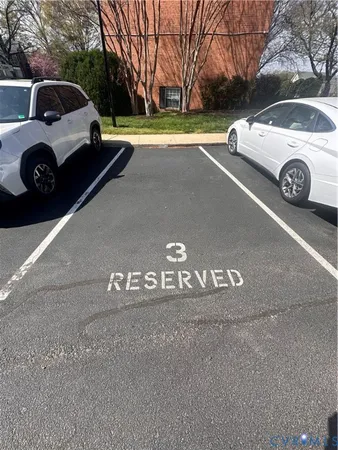 a view of street with parked cars