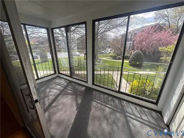 a view of a room with large windows