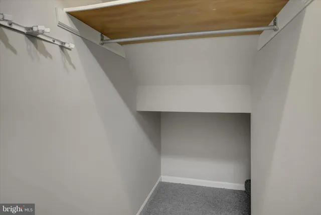 a view of a room with racks on the wall