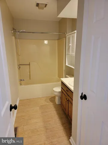 a bathroom with a shower and a toilet