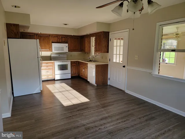 a kitchen with stainless steel appliances a refrigerator and a sink