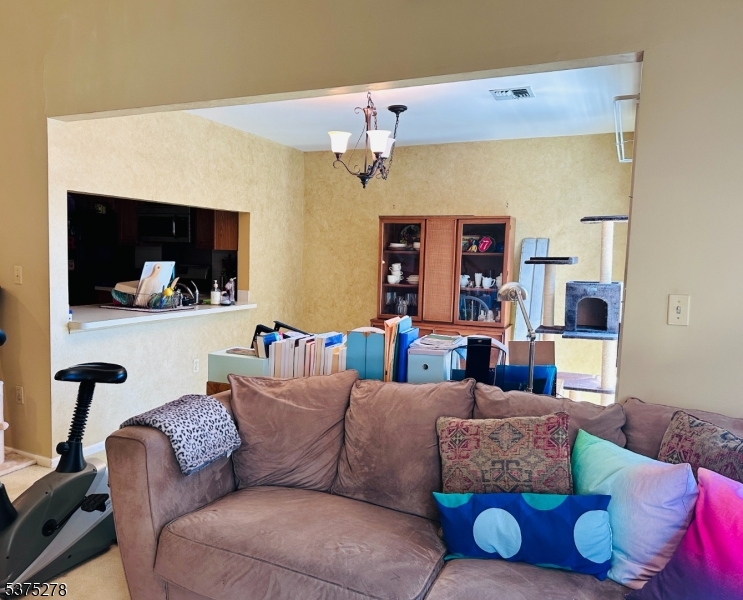 70 Boulder Run Road Paterson, NJ 07501 - Photo 15 of 29 a living room with furniture and a mirror