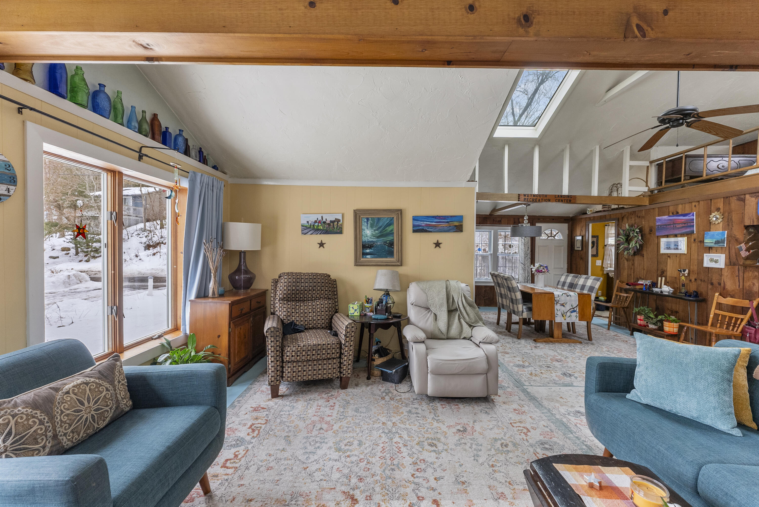 24 E Road Mashpee, MA 02649 - Photo 13 of 43 a living room with furniture and a floor to ceiling window