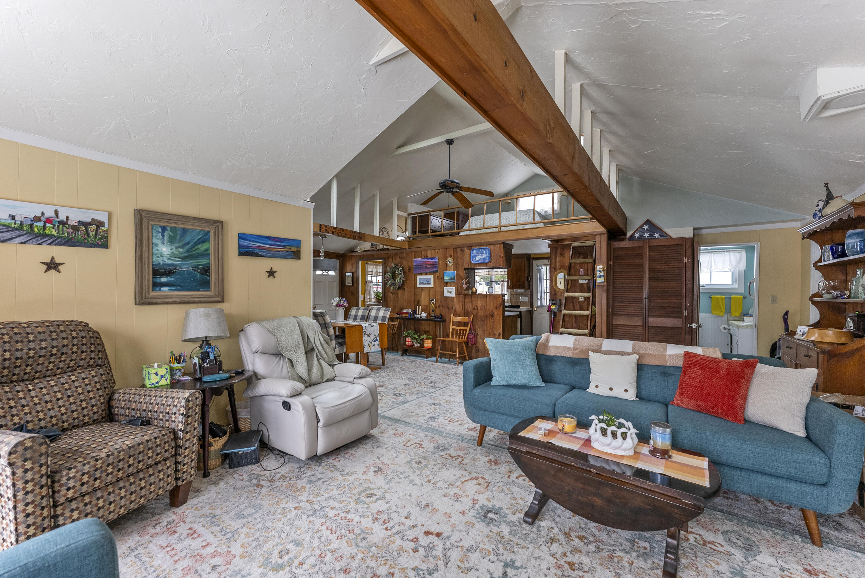 24 E Road Mashpee, MA 02649 - Photo 14 of 43 a living room with furniture a rug and a large window
