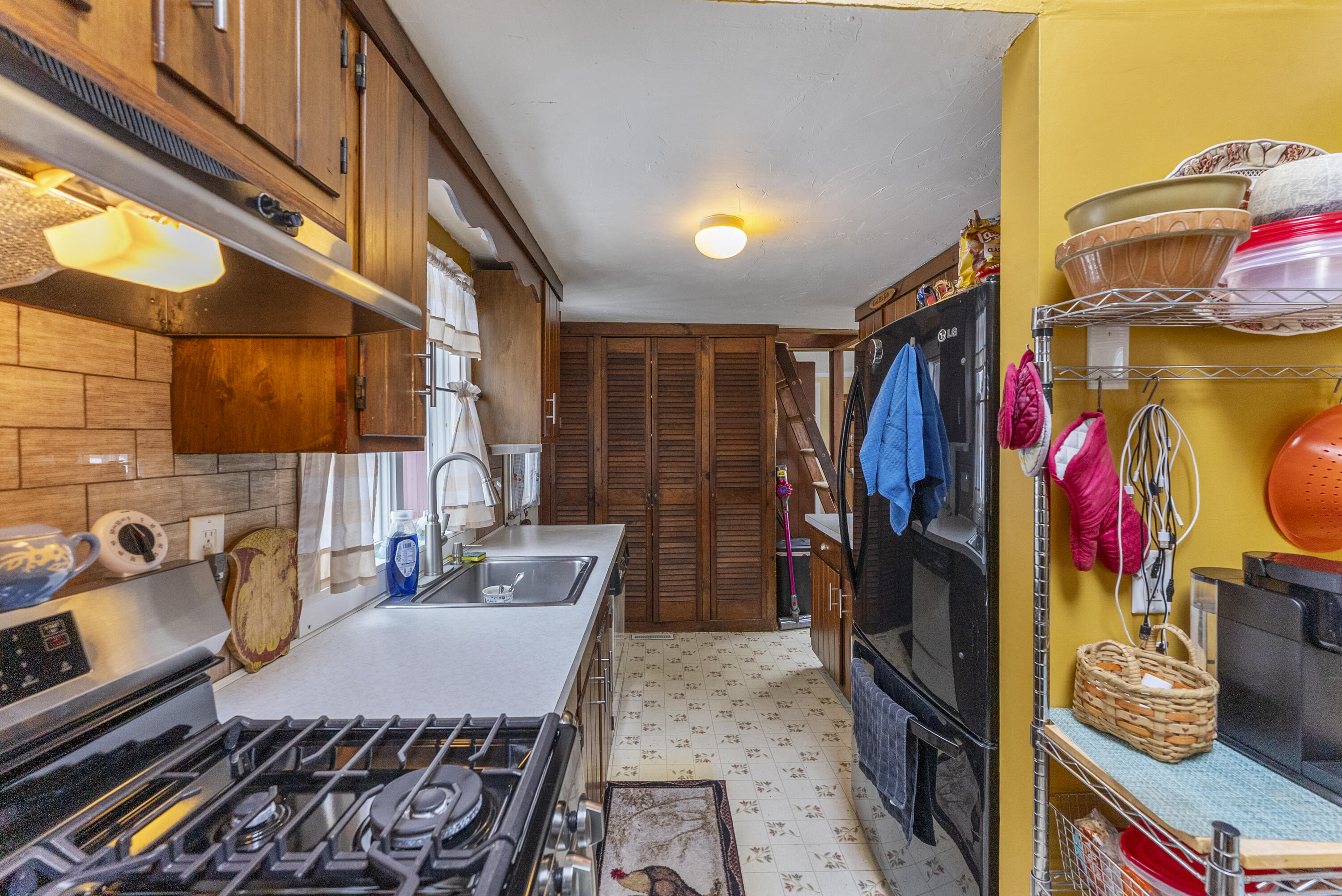 24 E Road Mashpee, MA 02649 - Photo 26 of 43 a view of walk in closet with clothes and shoes