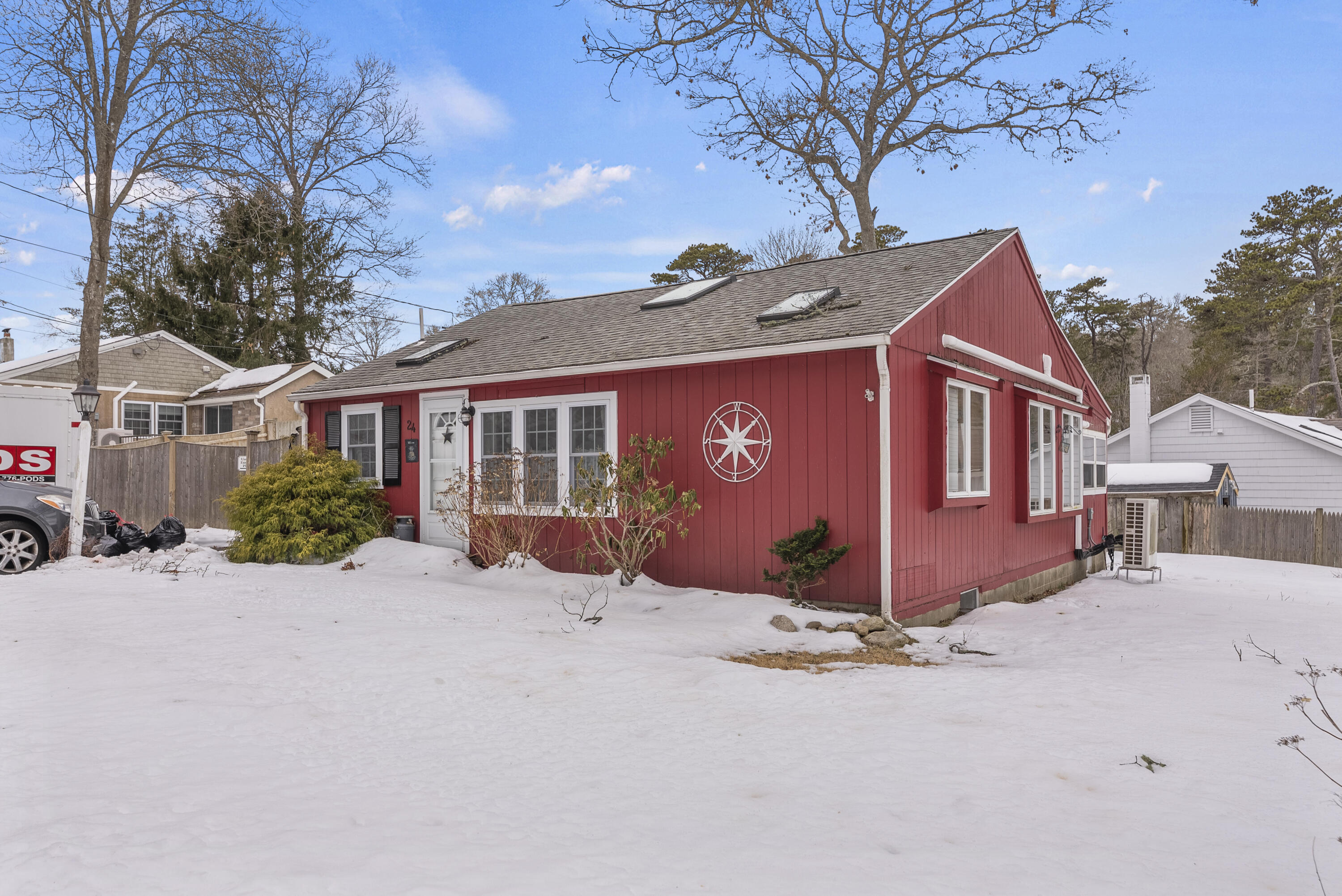 24 E Road Mashpee, MA 02649 - Photo 3 of 43 a view of a house with a yard covered in snow