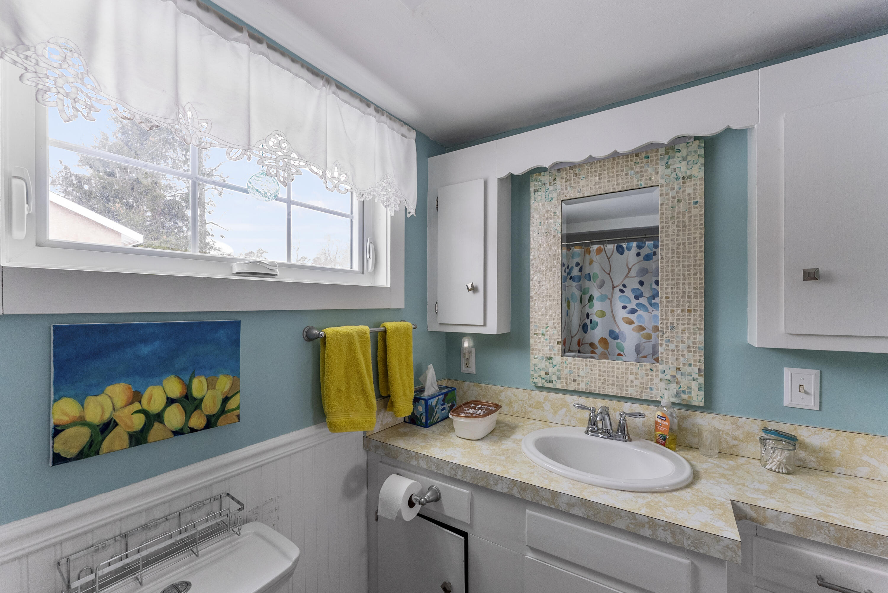 24 E Road Mashpee, MA 02649 - Photo 32 of 43 a bathroom with a granite countertop sink mirror and vanity