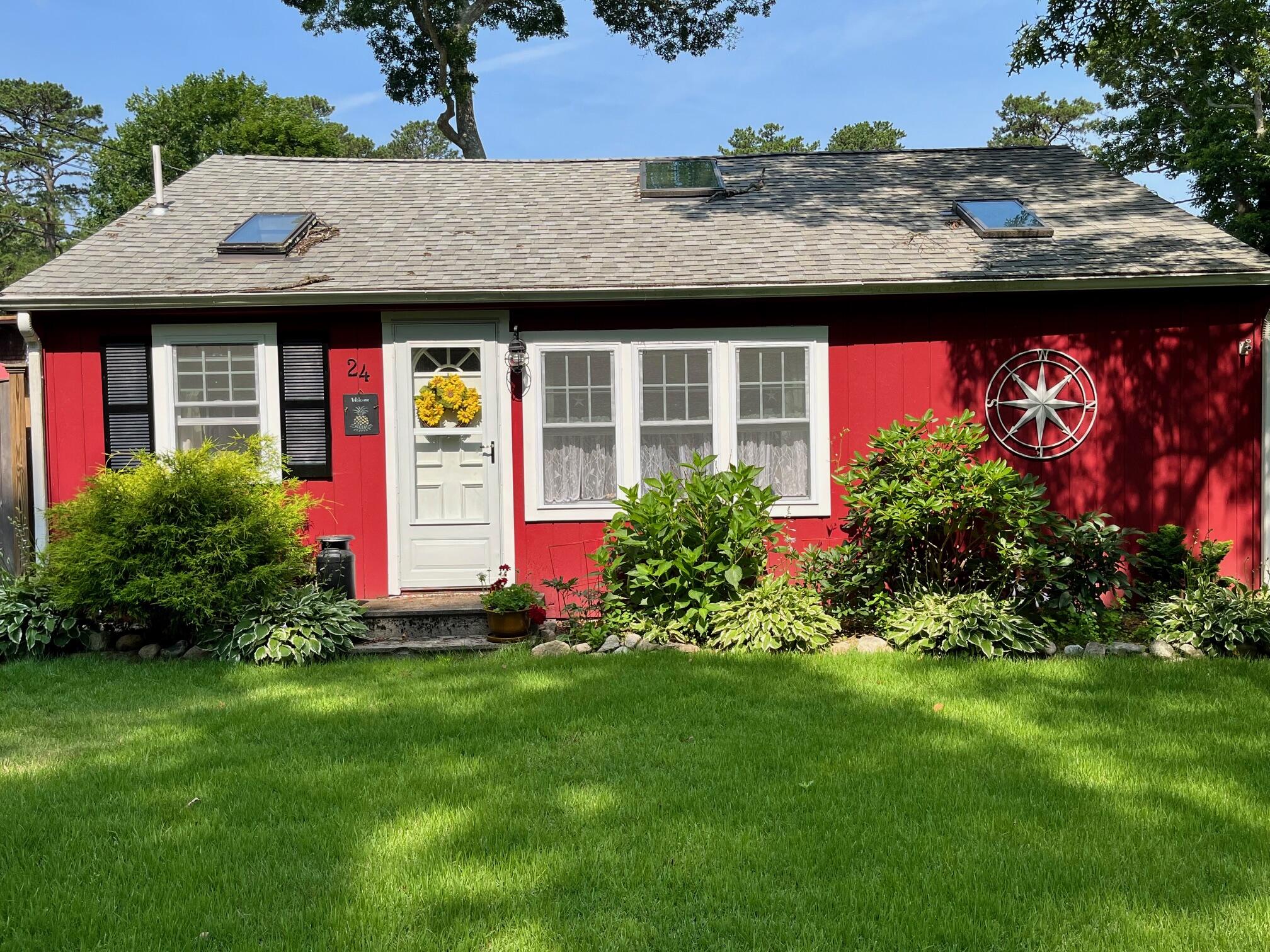 24 E Road Mashpee, MA 02649 - Photo 40 of 43 a front view of house with yard