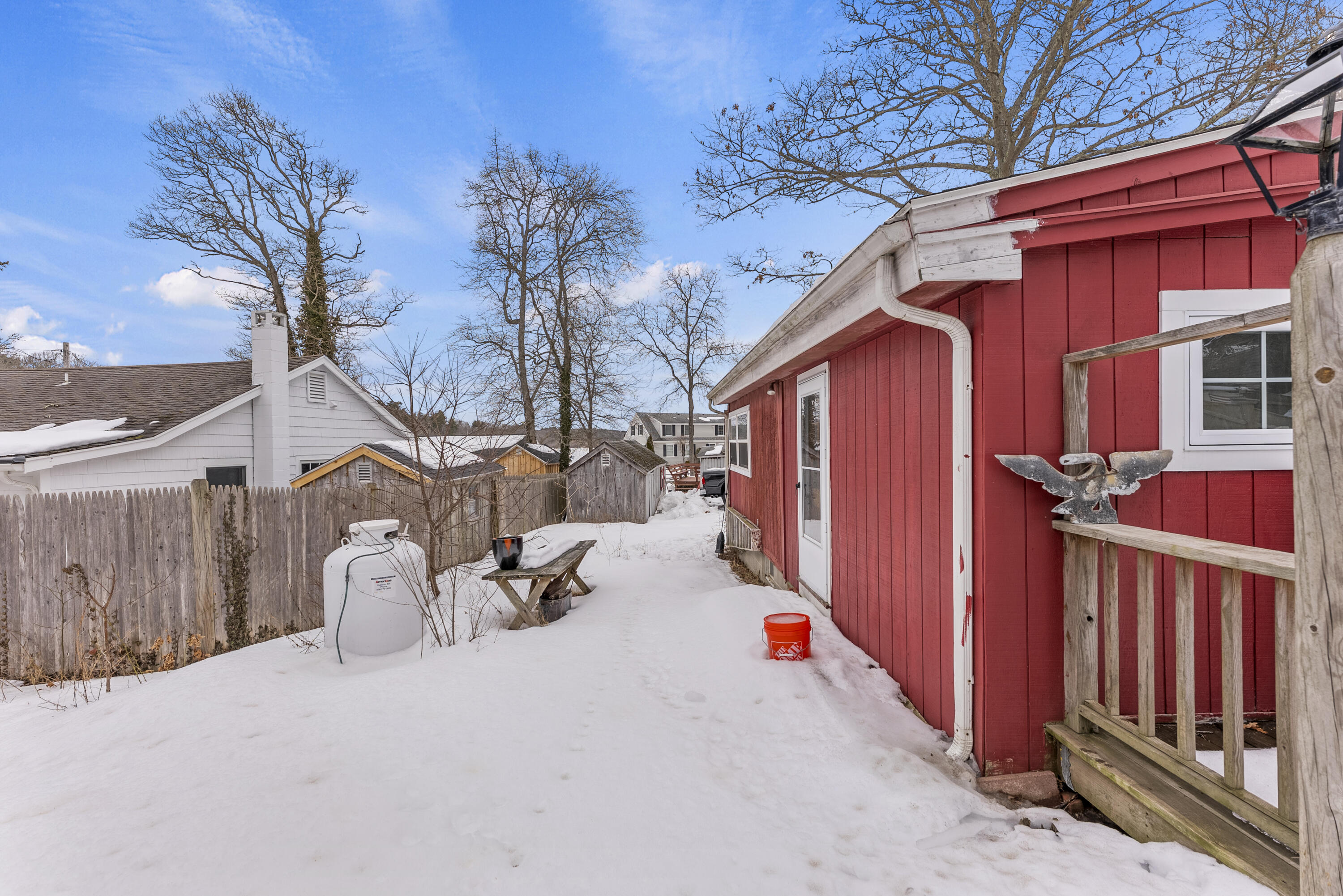 24 E Road Mashpee, MA 02649 - Photo 5 of 43 a view of a house with wooden fence