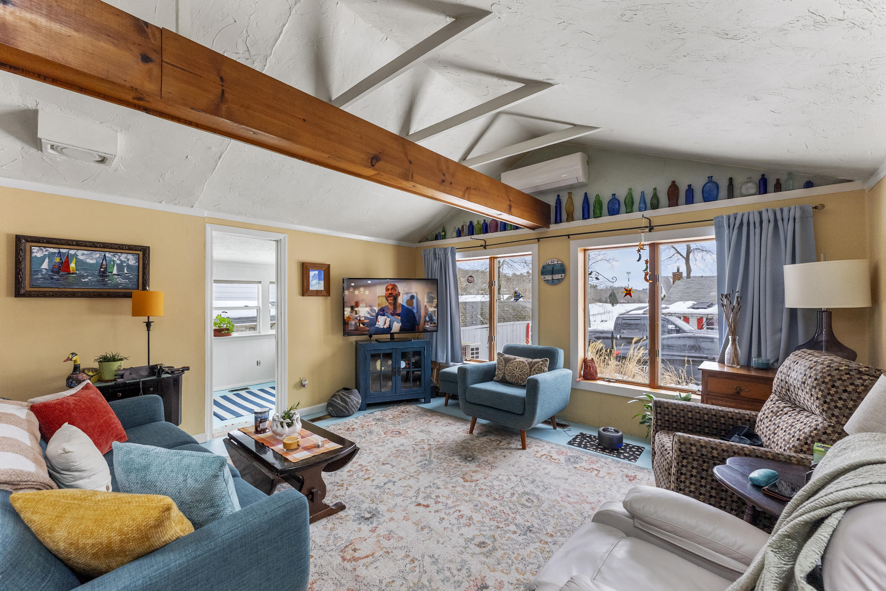 24 E Road Mashpee, MA 02649 - Photo 10 of 43 a living room with furniture and a flat screen tv