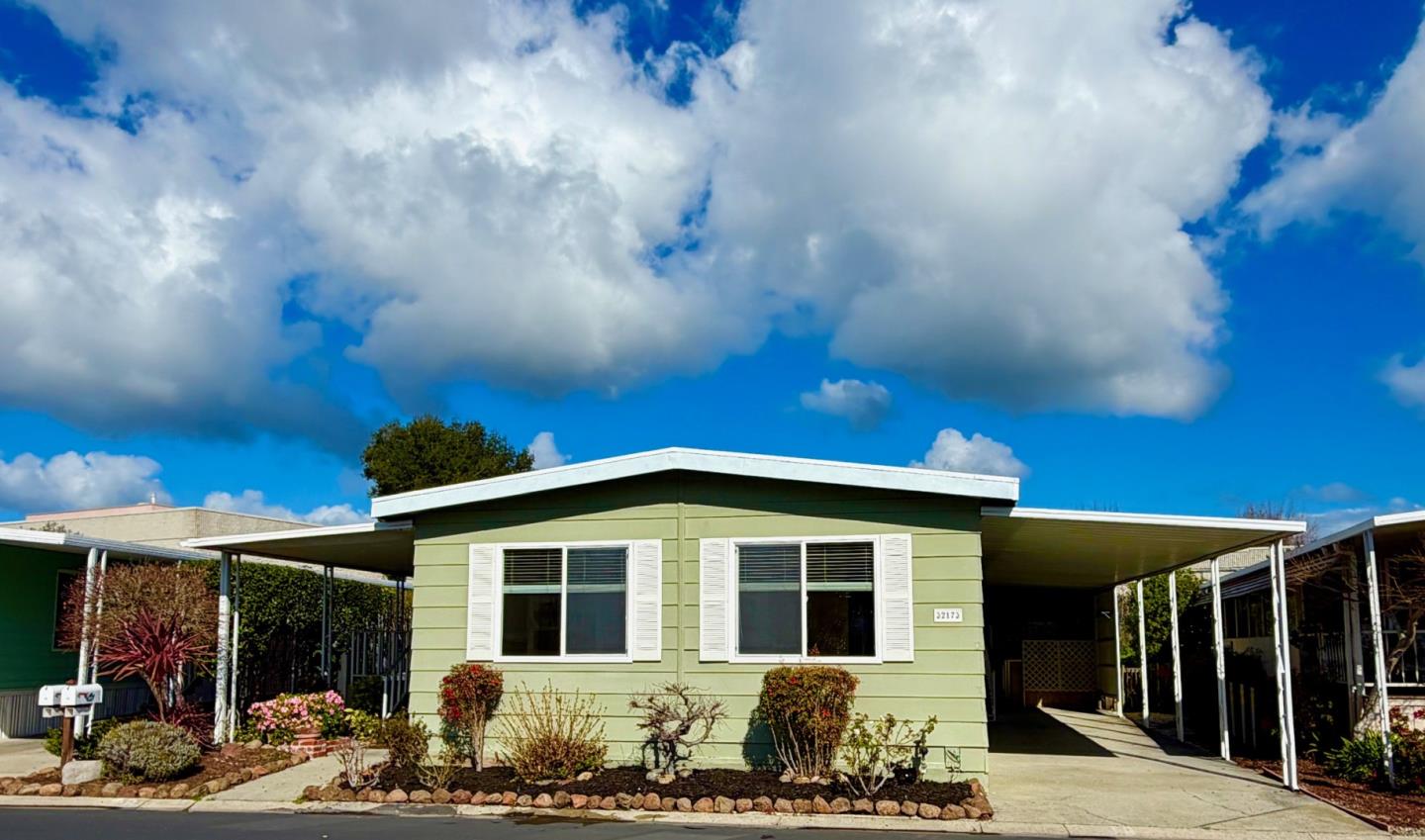 a front view of a house with yard