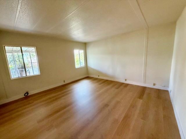 225 Mt Hermon Road, Unit 217 Scotts Valley, CA 95066 - Photo 11 of 29 a view of empty room with wooden floor and fan