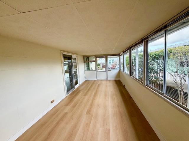225 Mt Hermon Road, Unit 217 Scotts Valley, CA 95066 - Photo 13 of 29 a view of a living room hardwood floor and a large window