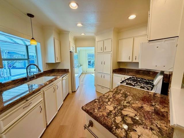 225 Mt Hermon Road, Unit 217 Scotts Valley, CA 95066 - Photo 6 of 29 a kitchen with stainless steel appliances granite countertop a stove a sink and a refrigerator