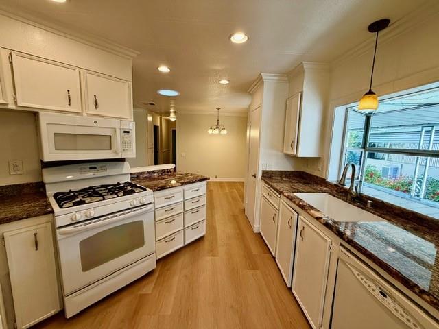 225 Mt Hermon Road, Unit 217 Scotts Valley, CA 95066 - Photo 7 of 29 a kitchen with stainless steel appliances granite countertop a stove a sink and a microwave