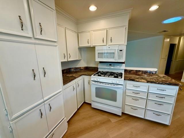225 Mt Hermon Road, Unit 217 Scotts Valley, CA 95066 - Photo 8 of 29 a kitchen with granite countertop white cabinets and white appliances