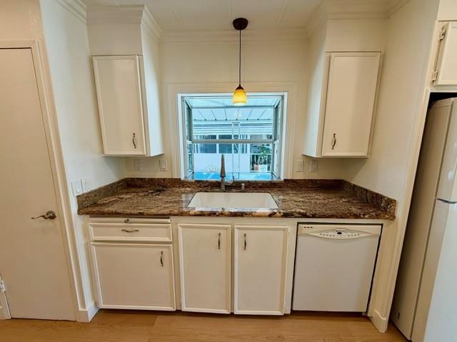 225 Mt Hermon Road, Unit 217 Scotts Valley, CA 95066 - Photo 9 of 29 a kitchen with granite countertop a stove a sink and a microwave