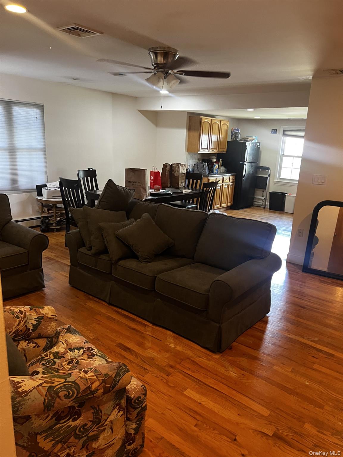 349 County Center Road, Unit TOP White Plains, NY 10603 - Photo 5 of 17 a living room with furniture and wooden floor