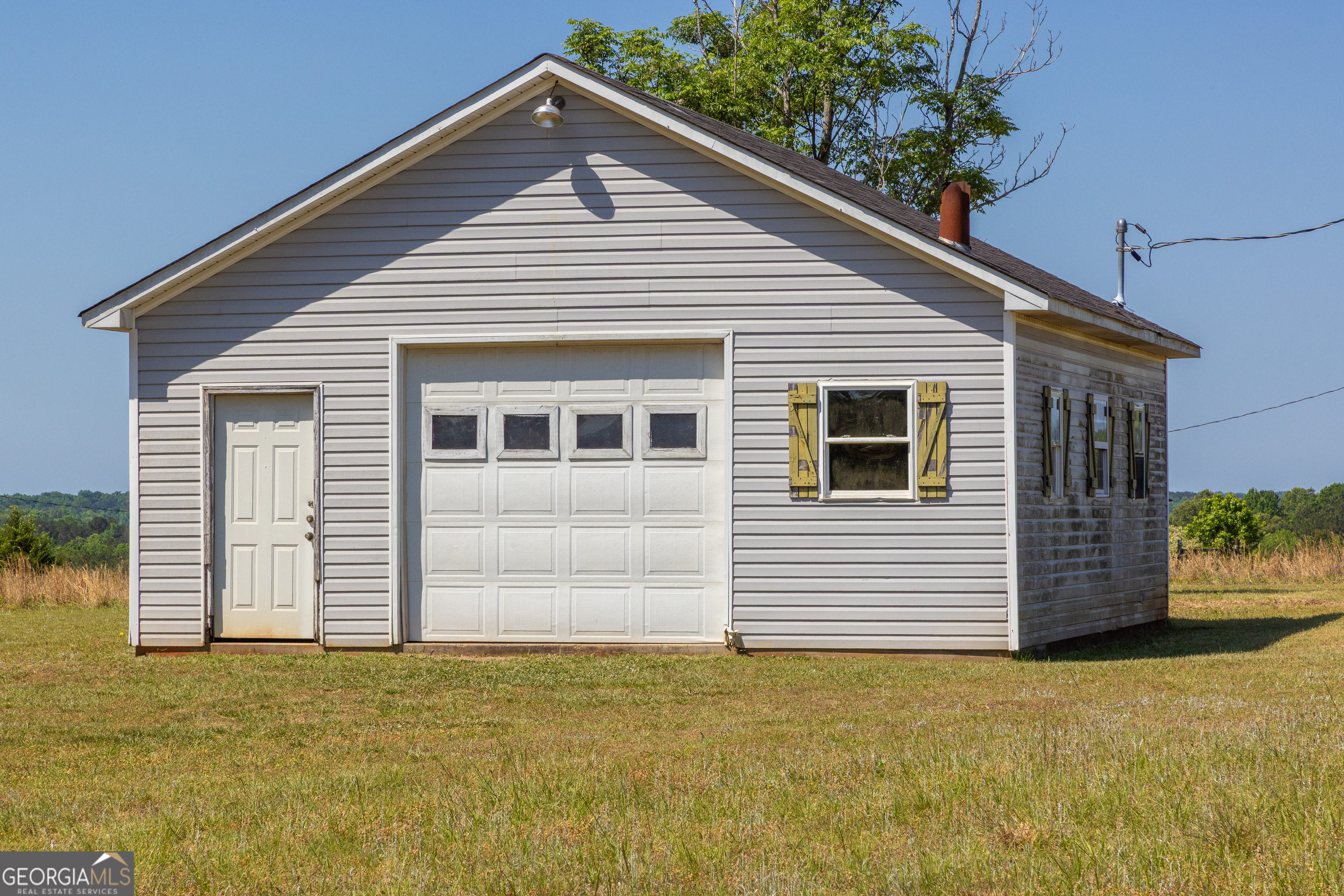 976 Windsweep Farm Road Thomaston, GA 30286 - Photo 59 of 64 a view of a house with a garage