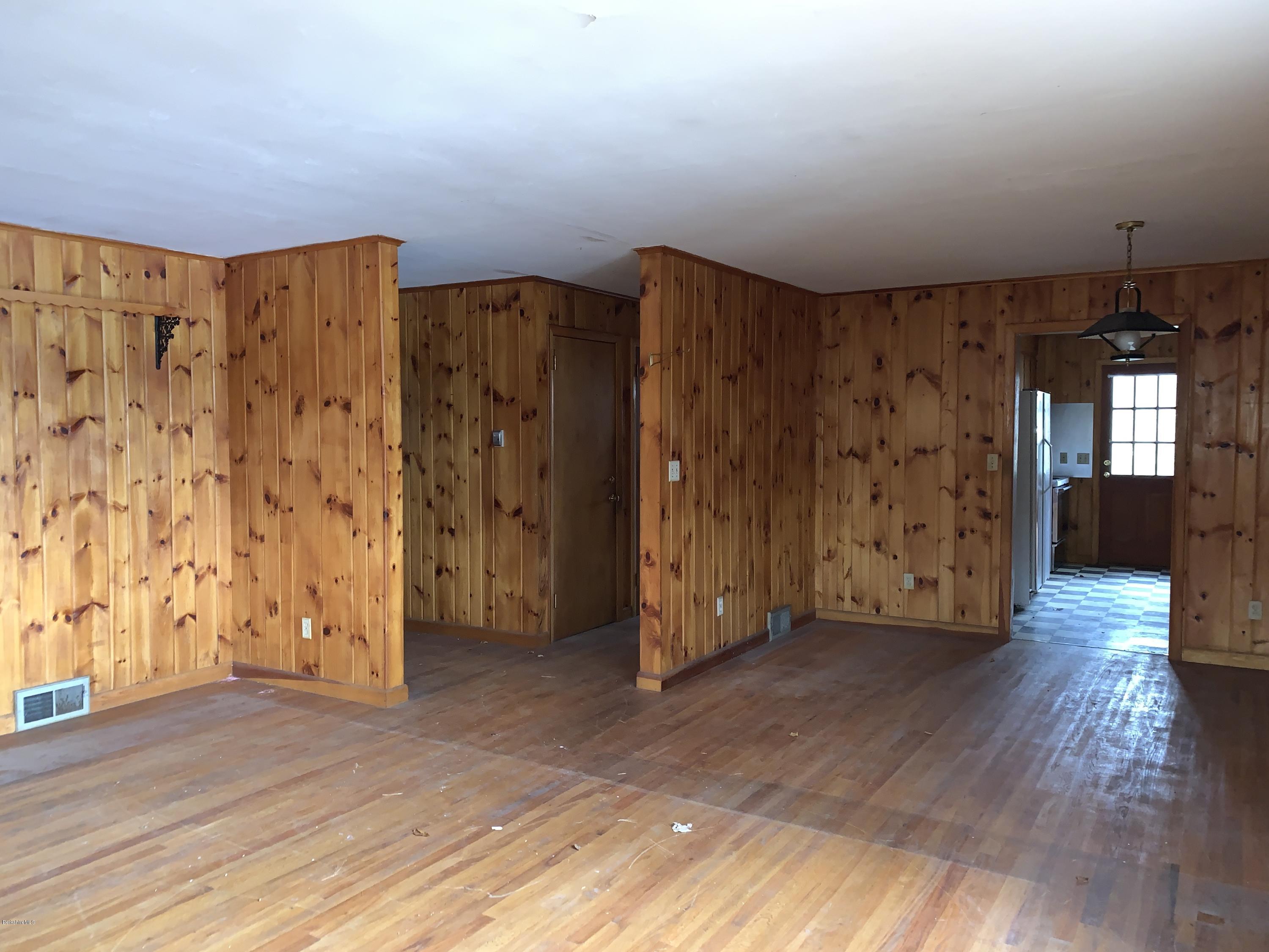 21 Point Road Monterey, MA 01245 - Photo 11 of 25 an empty room with wooden floor and windows