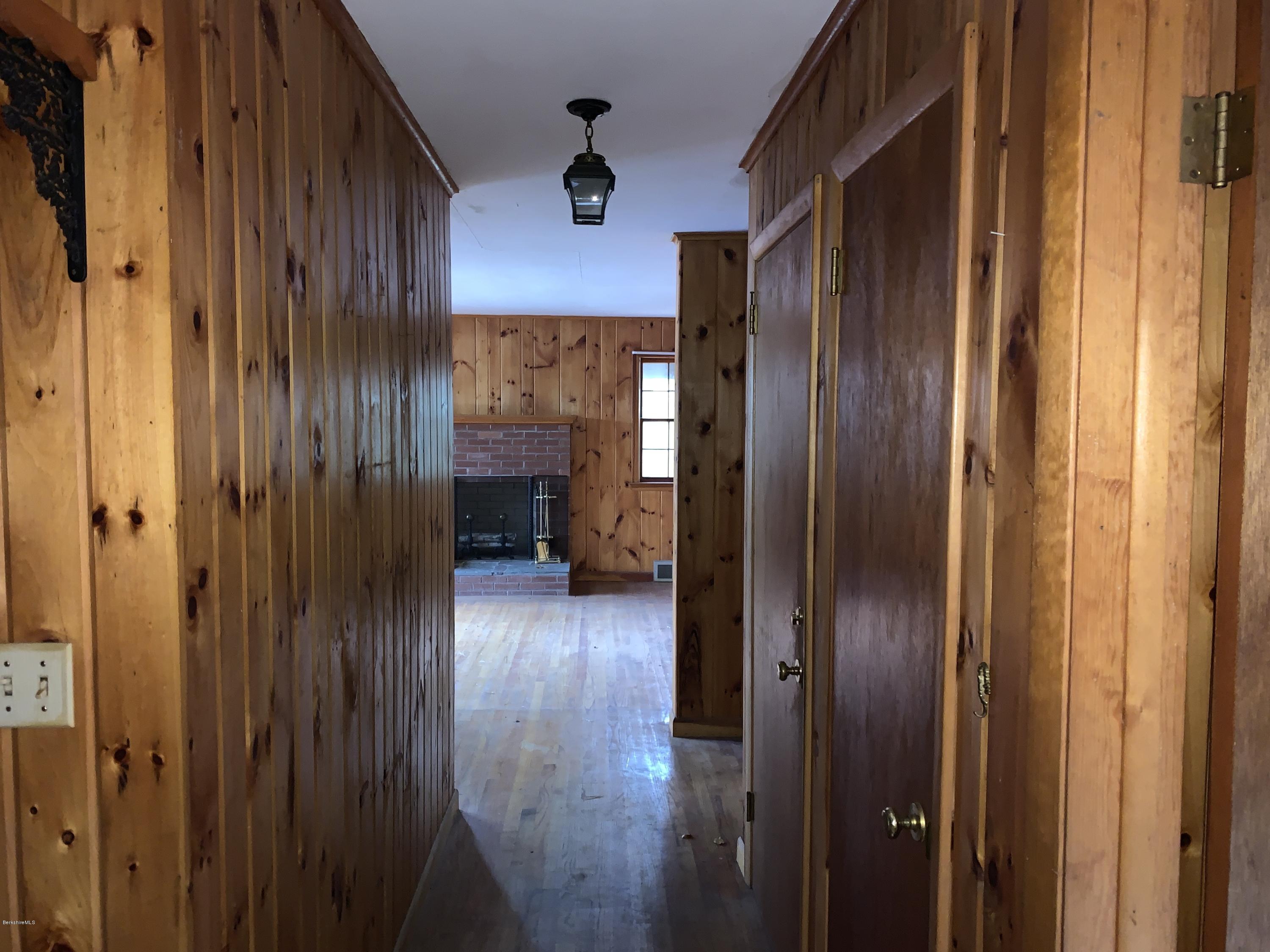 21 Point Road Monterey, MA 01245 - Photo 13 of 25 a view of a hallway with wooden floor and furniture