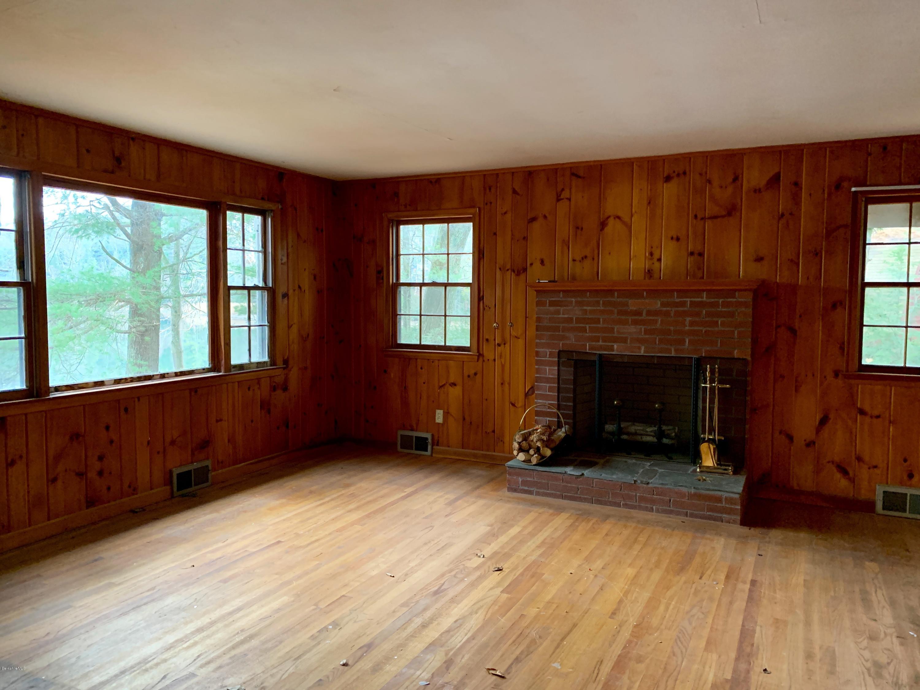 21 Point Road Monterey, MA 01245 - Photo 7 of 25 a living room with furniture and a fireplace